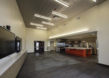 Break Room with open space and a bright red island